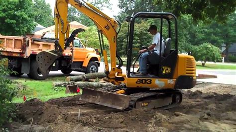 grading land with mini excavator|how to grade with an excavator.